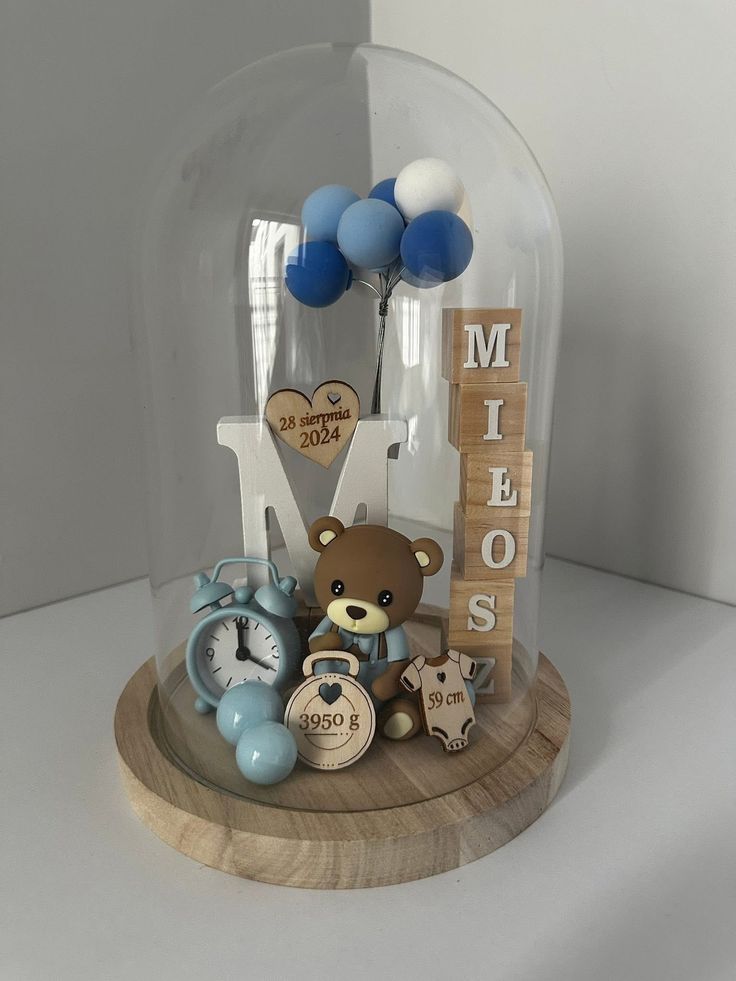 A thoughtfully arranged newborn gift basket with a soft blanket, keepsake, and personalized items in soft neutral tones